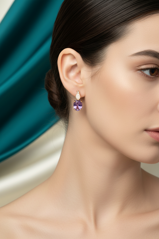 Model wearing purple stone hoop earrings